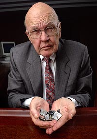 Jack Kilby Holding Modern Microchips 